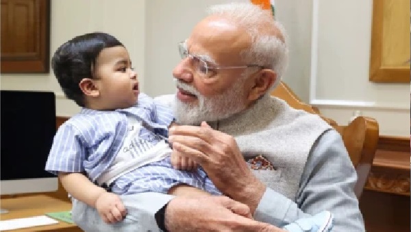 పీఎం మోదీ ఒడిలో కనిపిస్తున్న ఈ చిన్నారి ఎవరు? ఫోటో షేర్ చేస్తూ.. ‘చిన్నారి స్నేహితుడితో’ అని రాసిన ప్రధానమంత్రి