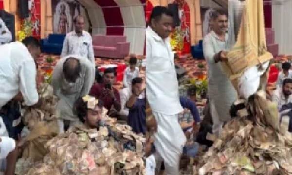 గుజరాత్ భజన సింగర్ వైరల్ వీడియో: నోట్ల కుప్పలో మునిగిపోయిన భజన సింగర్; బస్తాల కొద్దీ నోట్లు చల్లిన జనం; వీడియో వైరల్