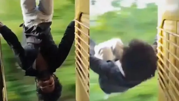 నడుస్తున్న రైలులో తలకిందులుగా వేలాడిన యువకుడు.. వైరల్ వీడియో చూసి జనం షాక్!