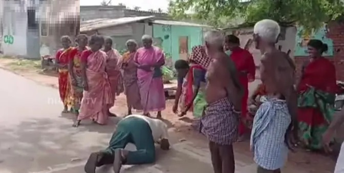 పన్ను వసూలు కోసం నడిరోడ్డుపై ప్రజల కాళ్లపై పడిన పంచాయతీ కార్యదర్శి..!