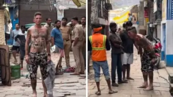 అర్ధనగ్న ప్రదర్శన..! ఇళ్లలోకి చొరబడిన విదేశీ యువకుడు.. పిచ్చిపట్టినట్లు వస్తువులను ధ్వంసం చేస్తూ, చేతులు కొరుకుతూ.. పోలీసులనే బెదిరించిన ధైర్యం.. షాకింగ్ వీడియో..!